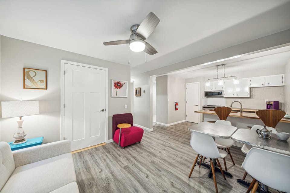 The common area and kitchen flow together in the downstairs apartment.