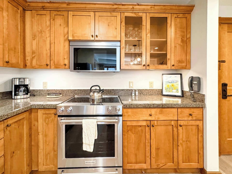  kitchen with a functional layout including a sink and stove