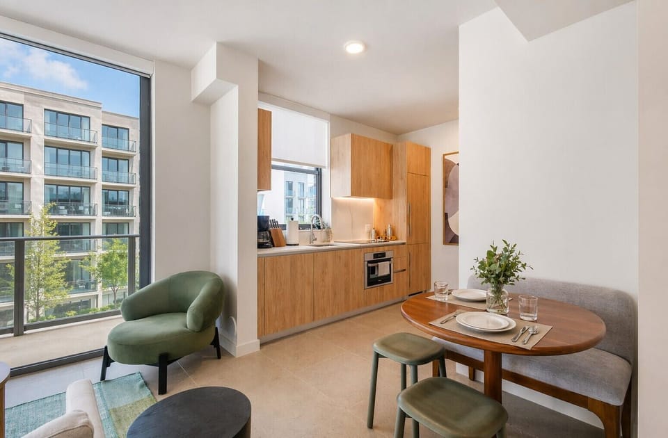 Enjoy a quiet moment in the dining nook, featuring plush bench seating and city views.