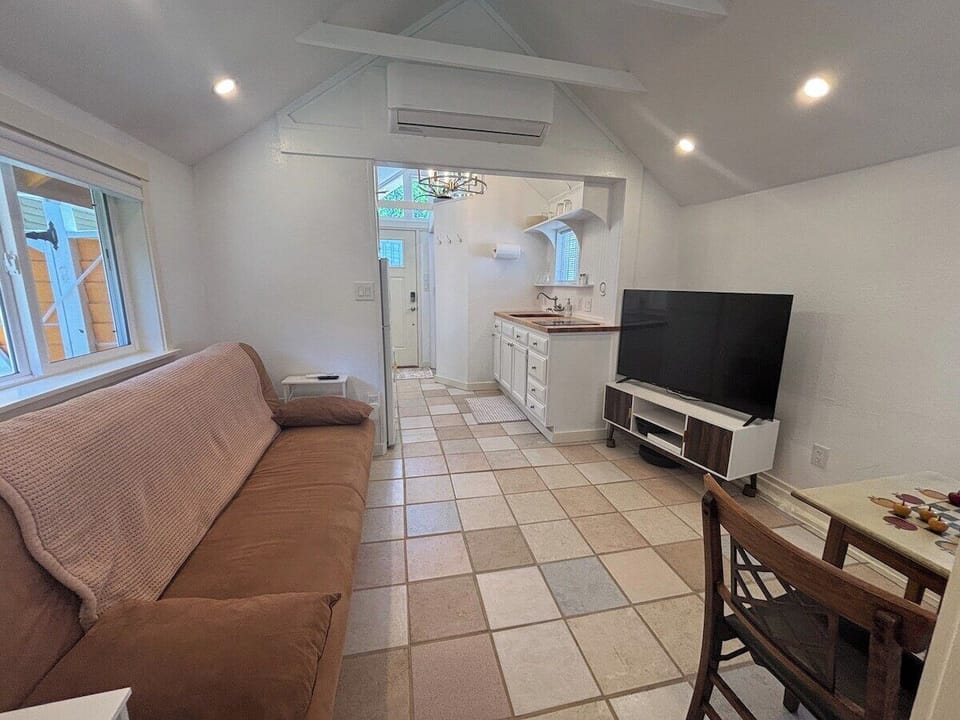 Relax with Smart TV and sleeper sofa in this cozy, efficient layout