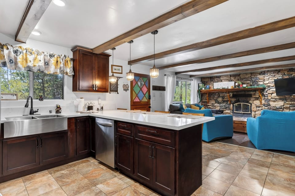 Fully equipped kitchen with spacious island and bar seating.