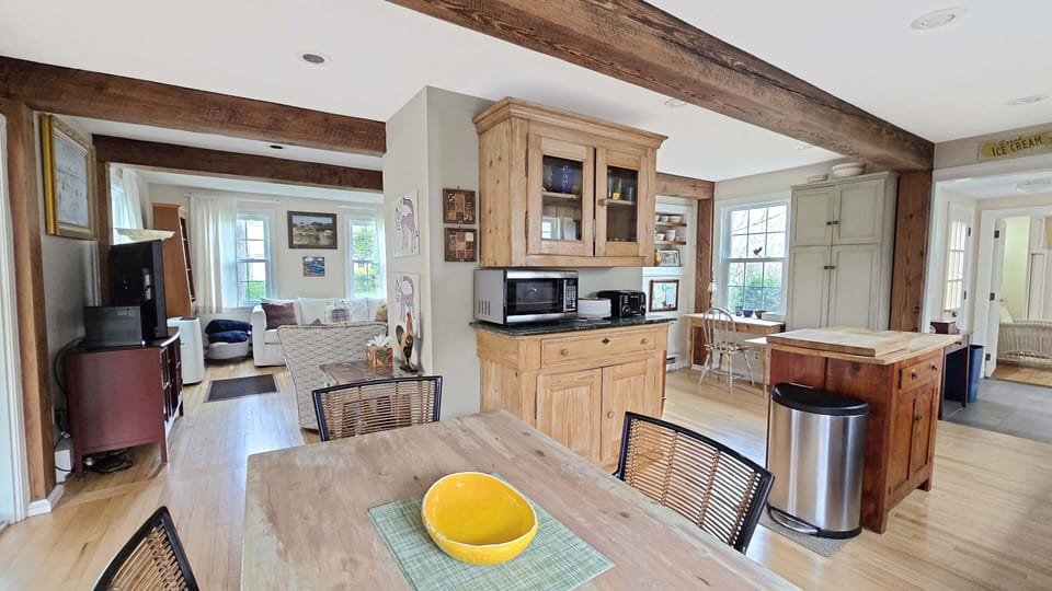 Dining area with kitchen beyond