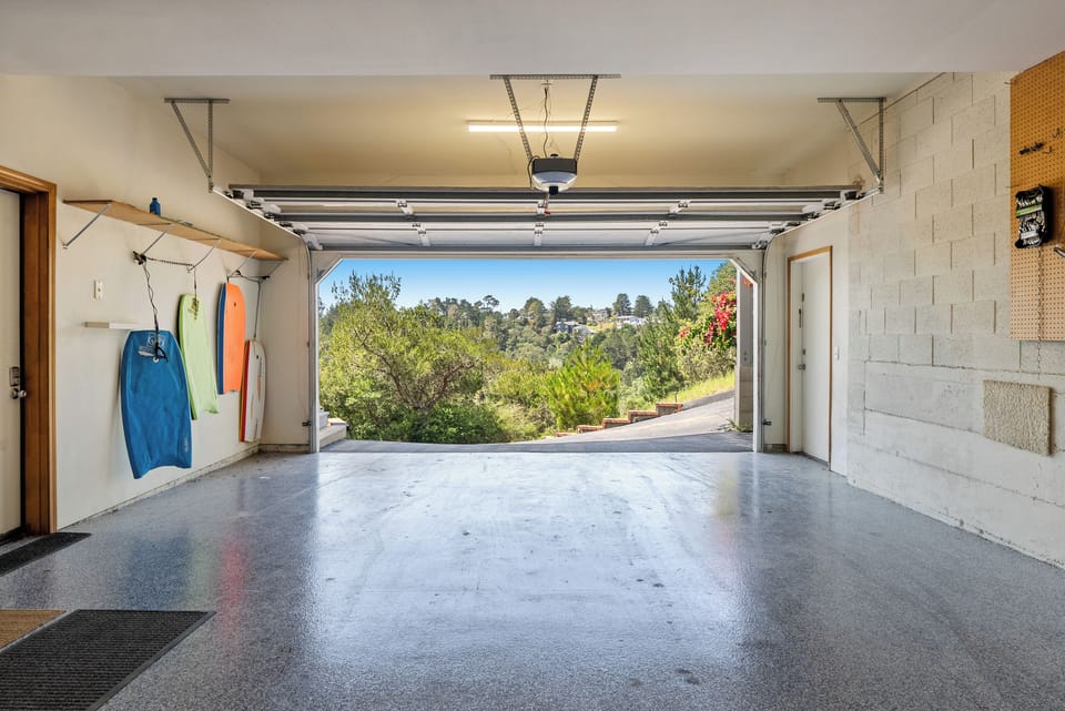 Spacious garage with an EV charger for modern convenience.
