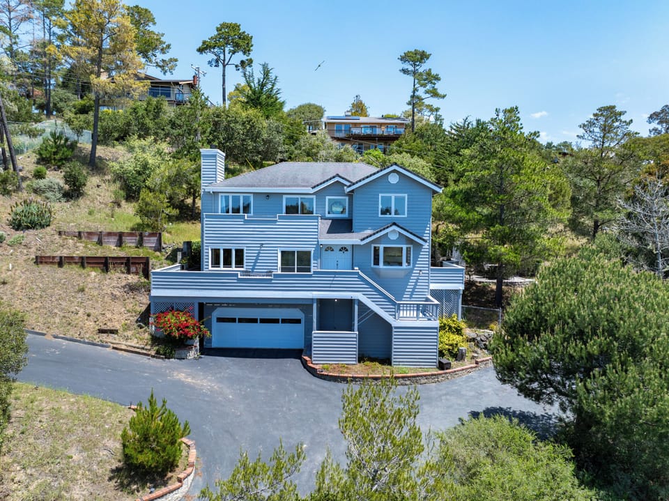 Updated split-level home with driveway and garage parking.