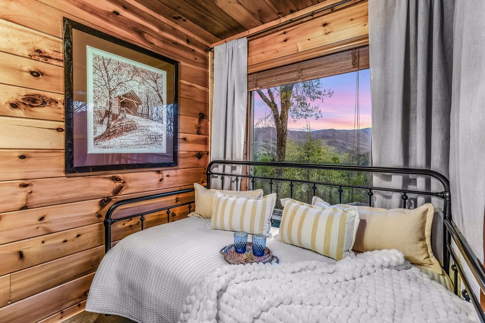 Cozy cabin daybed with stunning mountain sunset views