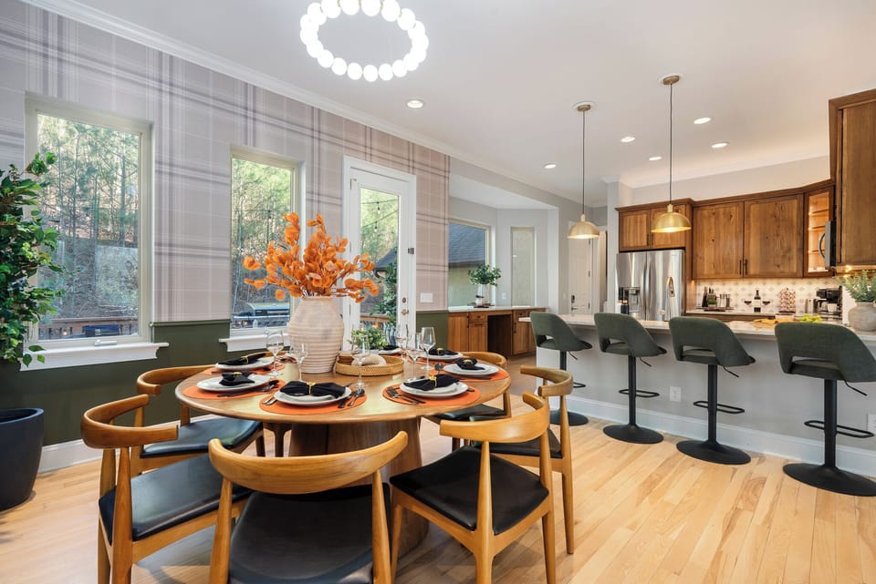 Open-concept kitchen and dining area - perfect for hosting group meals before heading out to explore Biltmore or downtown