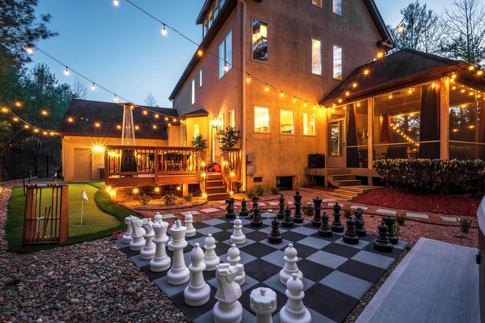 Outdoor giant chess + designer backyard setup - one of many spaces built for gathering and having fun together