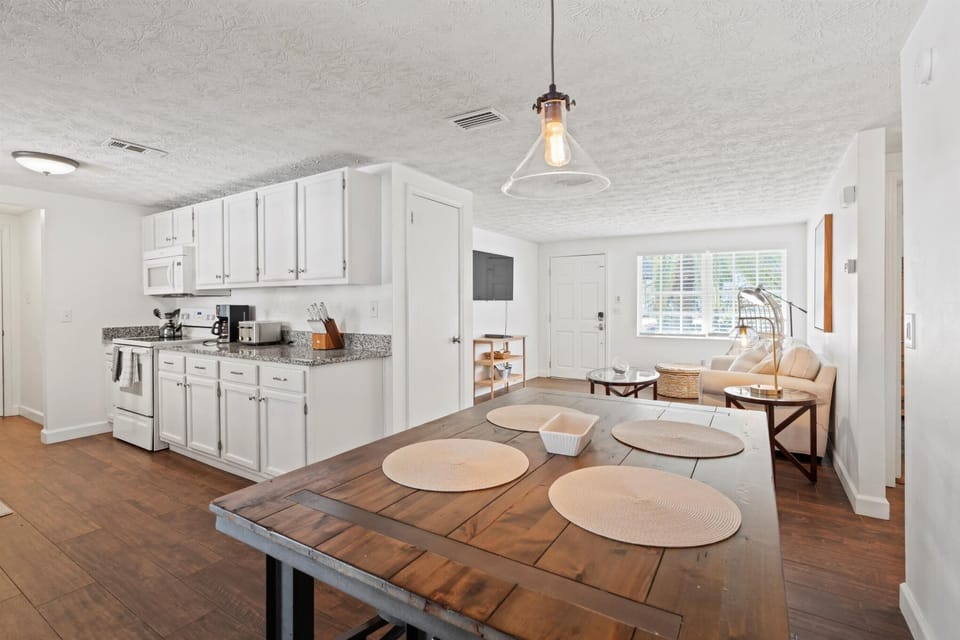 Open dining area connected to kitchen and living space