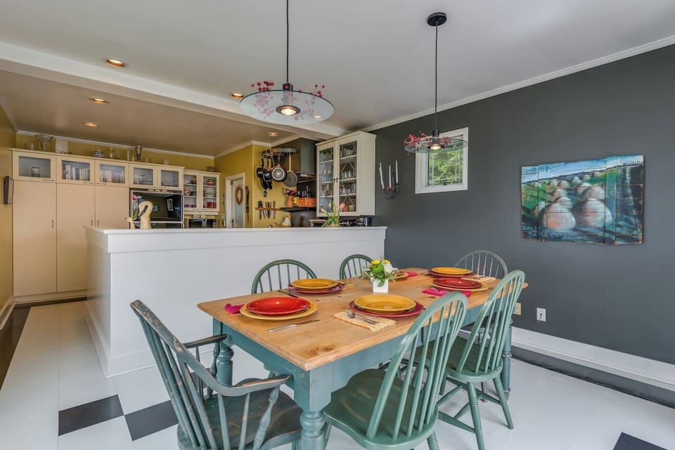 The dining area adjacent to the kitchen.   Open and friendly- great for conversation as meals are being prepared or drinks are being served!