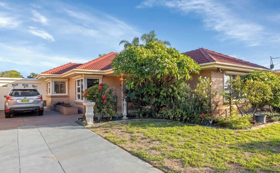 Spacious mid century home with off street parking for two cars.