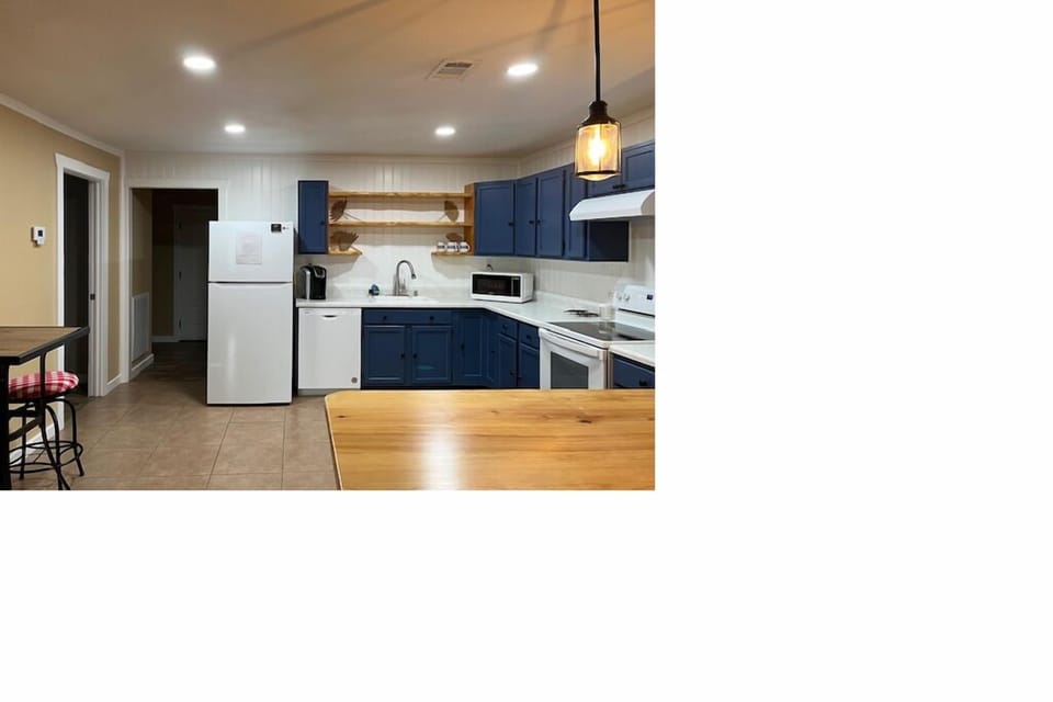 Kitchen with coffee maker, microwave, single sink