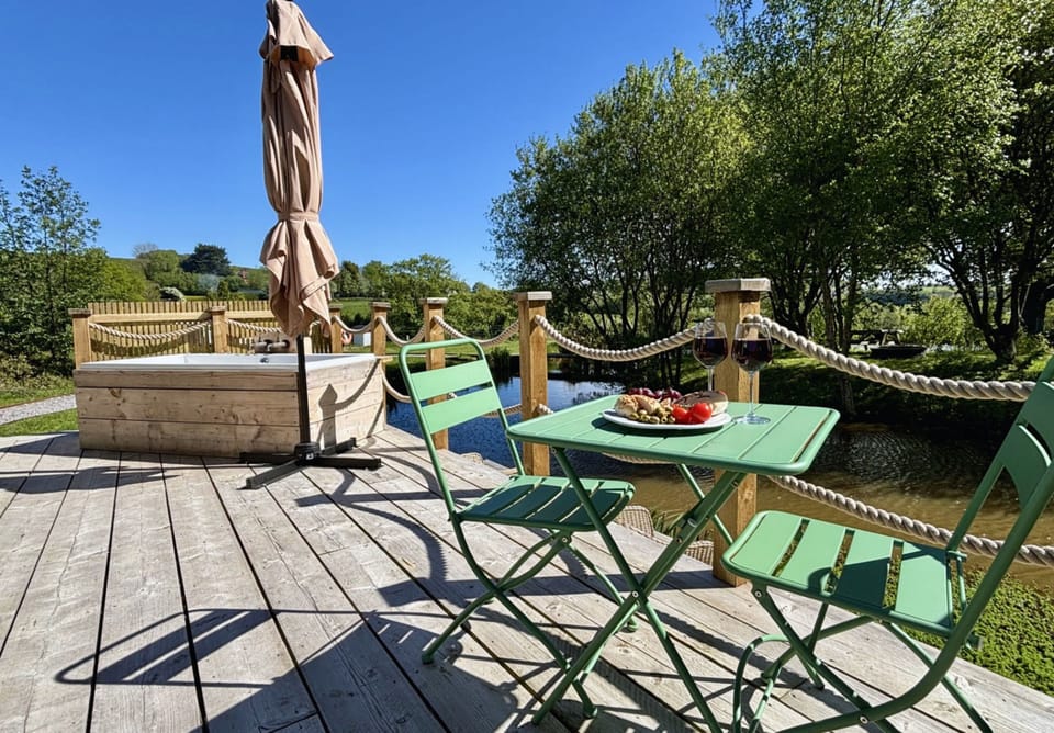 Decking with a jacuzzi bath overlooking the fishing lake