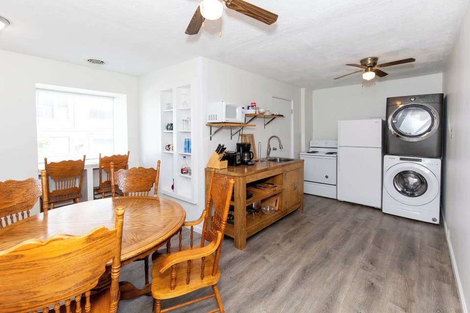 Dining table for six, with the kitchen and laundry just steps away
