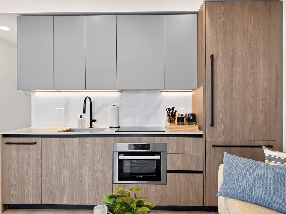 Fully equipped kitchenette with modern appliances, coffee machine, and essentials for easy meals.