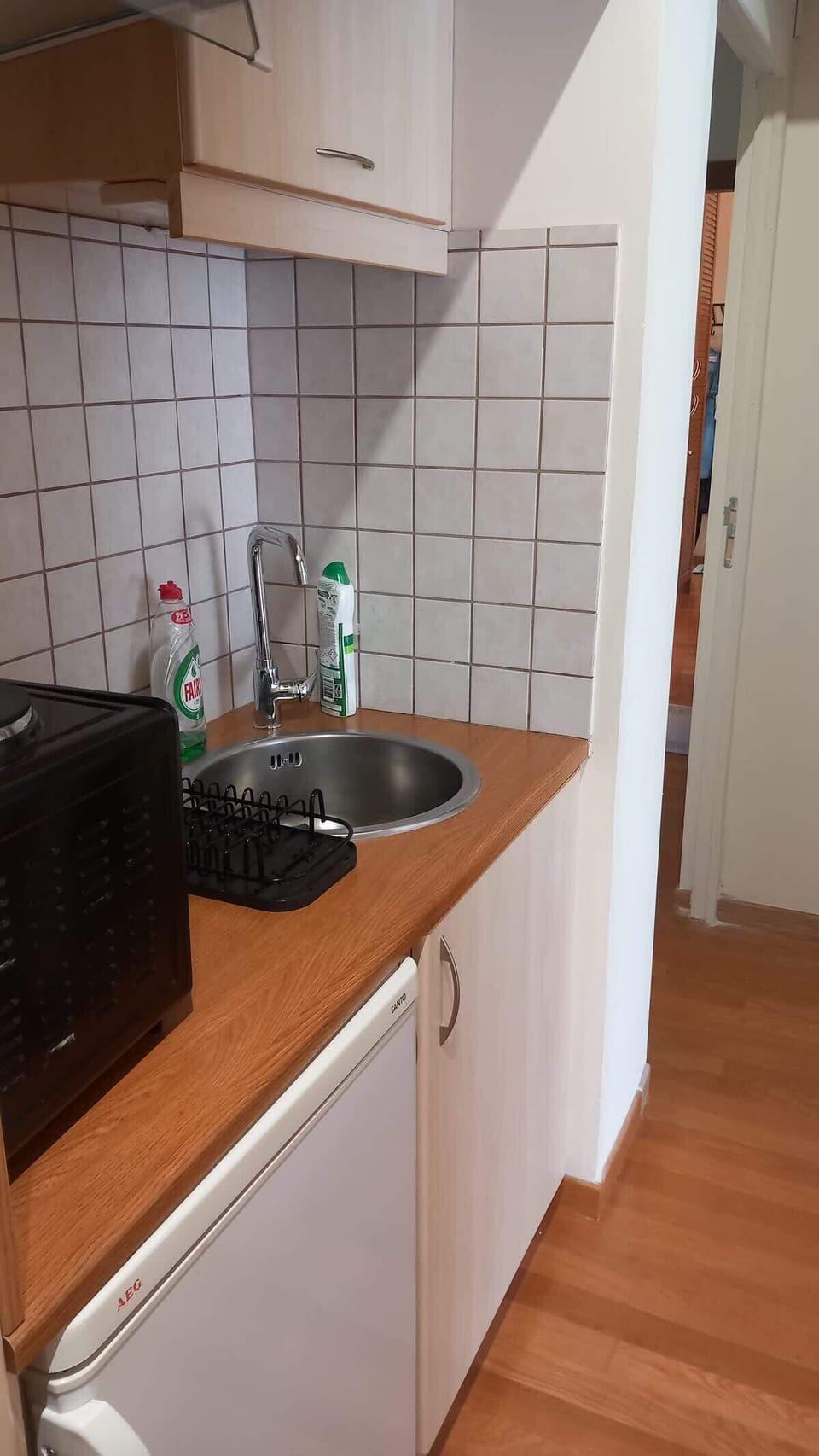 Another view of the kitchen counter and cooking area, keeping everything within easy reach.