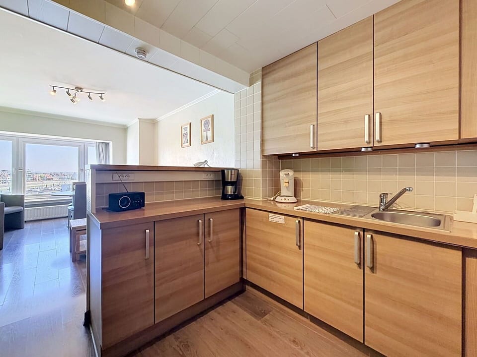 Flooring, Wood, Floor, Interior Design, Cabinetry, Countertop, Ceiling, Furniture, Wood Flooring, Kitchen