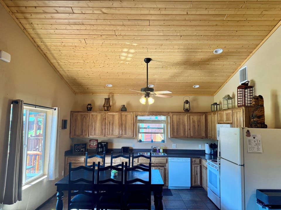 Rustic cabin kitchen with full appliances and large dining table