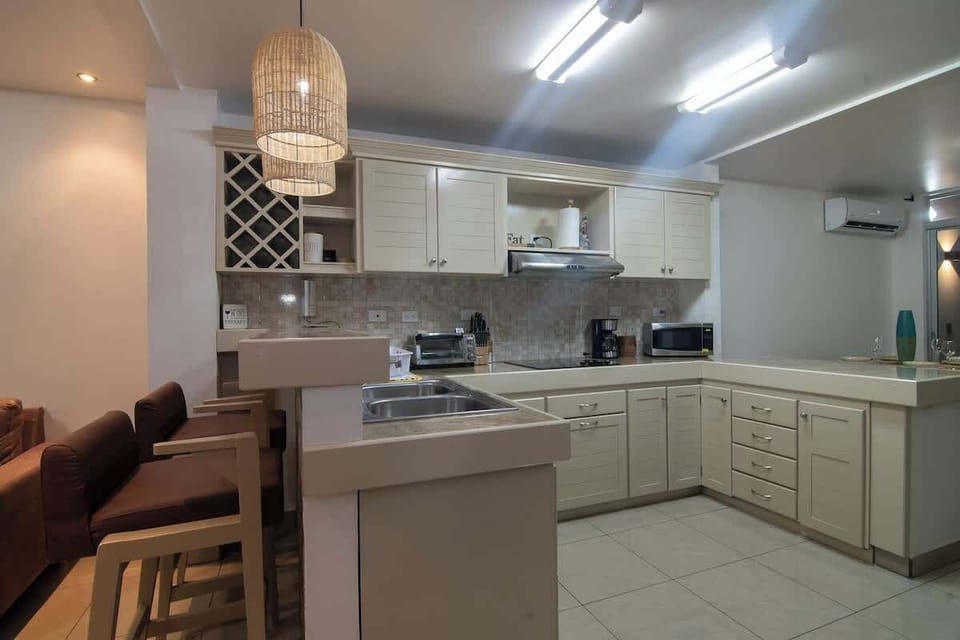 "Experience Costa Rican cuisine from the comfort of your own kitchen at Amara House Arenal. Our fully equipped kitchen includes modern appliances and a full range of cookware, utensils, and dishes to prepare delicious meals during your stay."