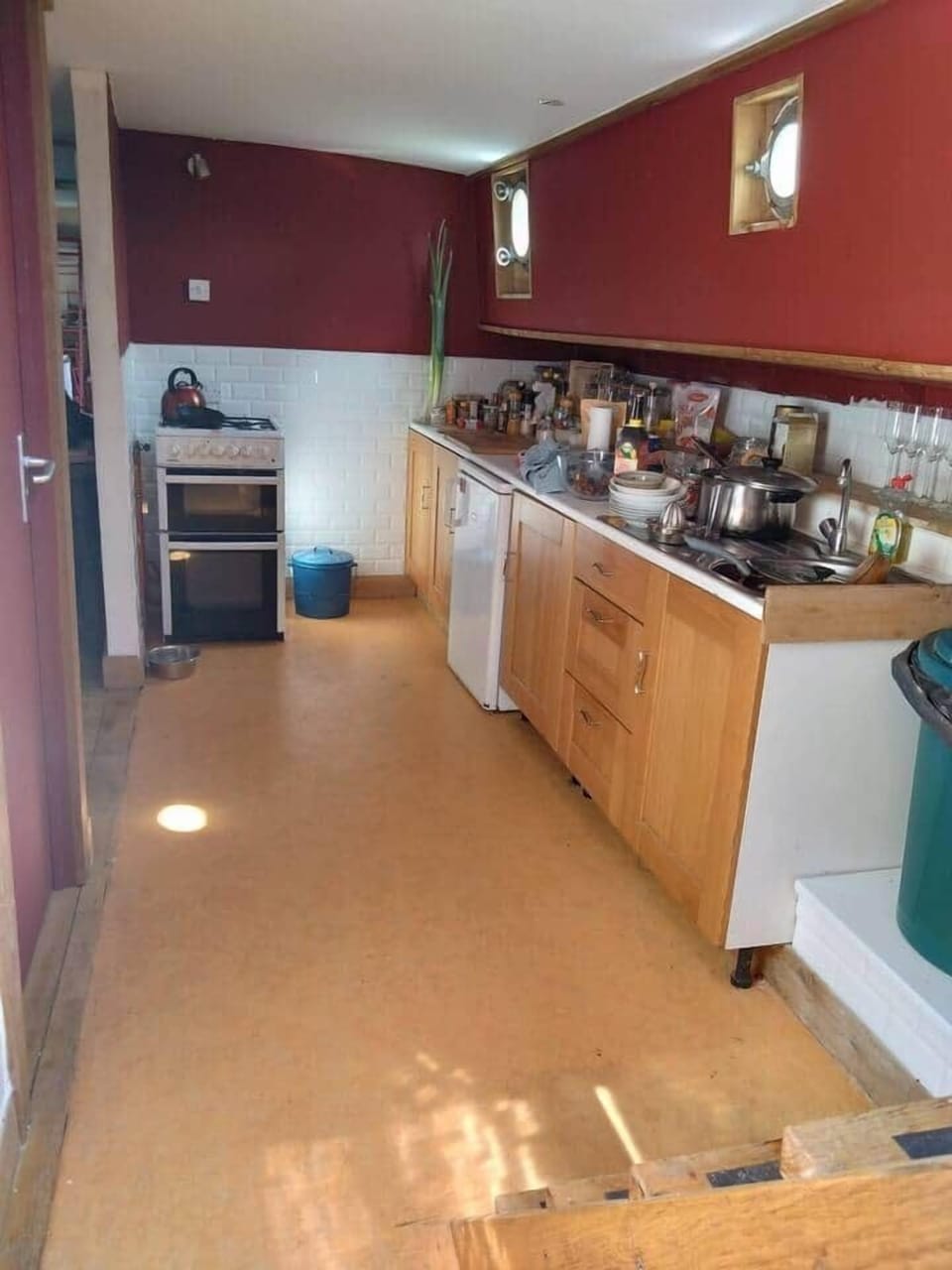 The kitchen/galley includes the gas oven with for gas rings above. An under worktop refrigerator, sink and bins for different grades of refuse.  All pots and pans are provided, as are plates and cutlery etc.