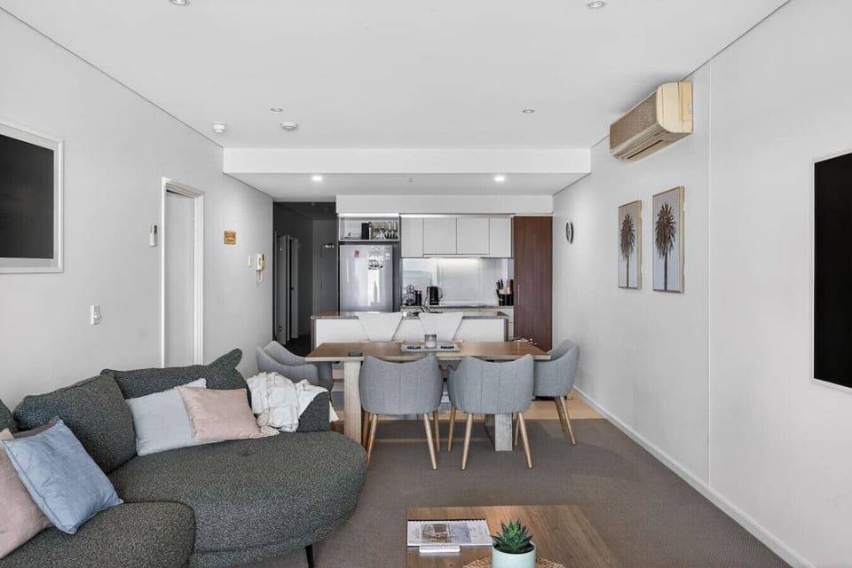The open-plan design connects kitchen, dining, and living areas, creating an easy flow for socialising and time together.
