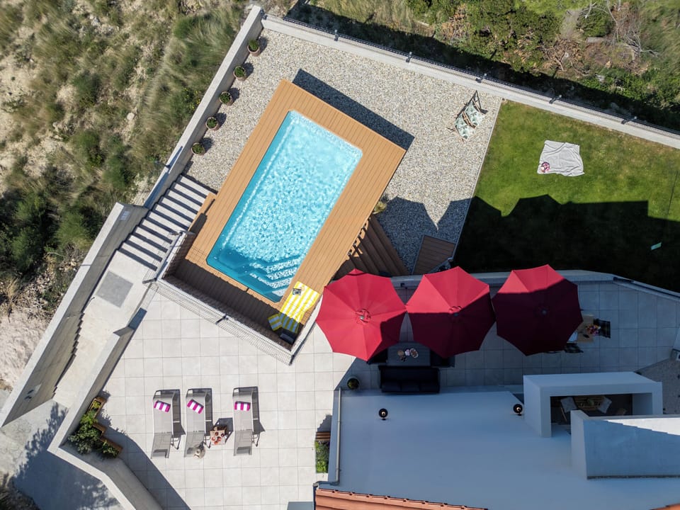 Pool, garden and lounge set for relaxation.