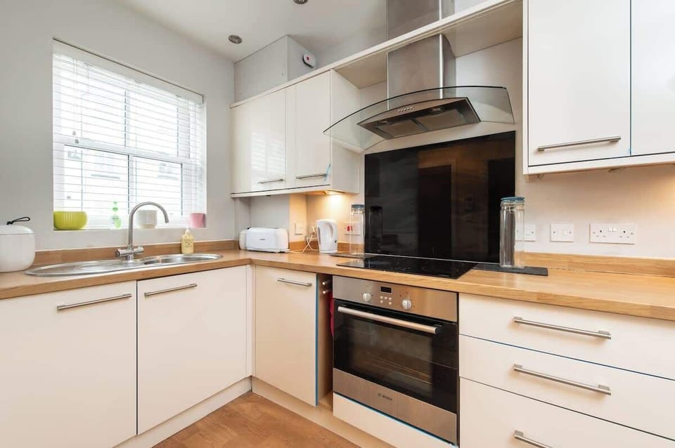 Modern Kitchen: Whip up culinary delights in this sleek, well-equipped space with stylish decor!

