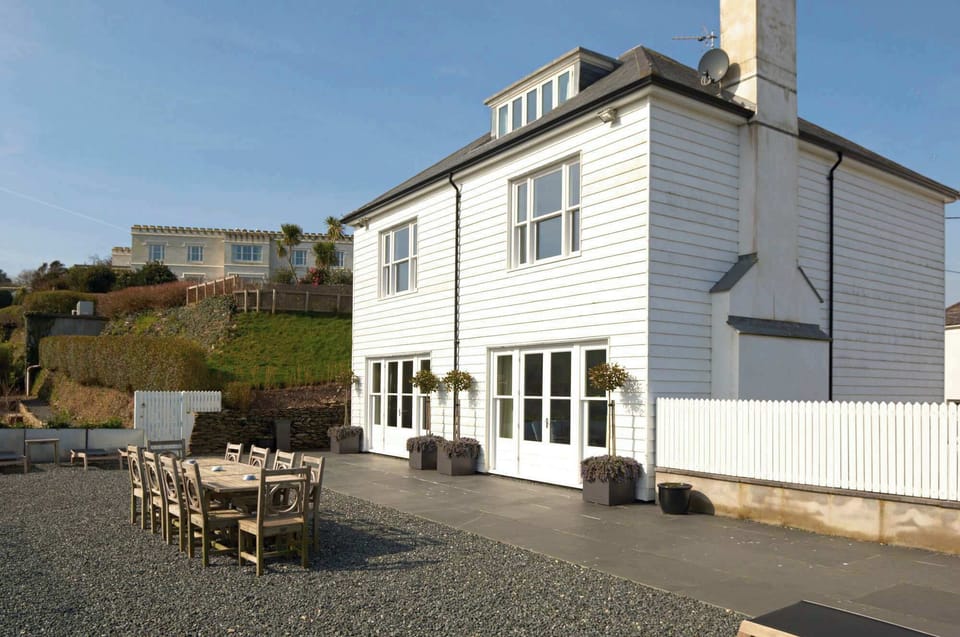
Penpol's exterior with outdoor seating and panoramic countryside views