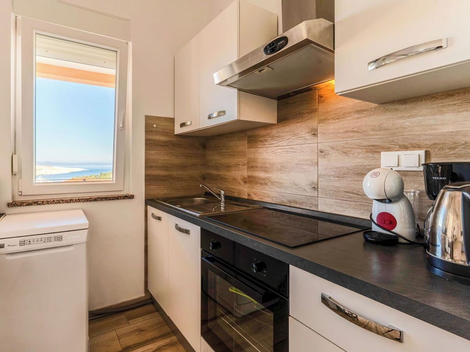 Wood, Interior Design, Flooring, Major Appliance, Floor, Ceiling, Cabinetry, Countertop, Room, Furniture