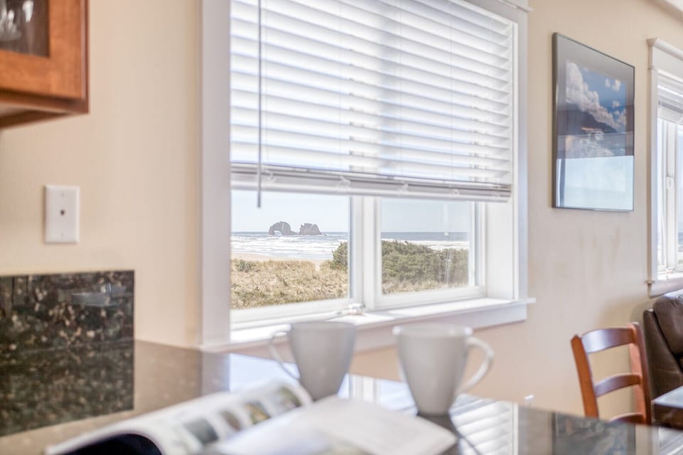 Wake up to stunning ocean views from your cozy bedroom, where morning coffee tastes even better with coastal rock formations as your backdrop.