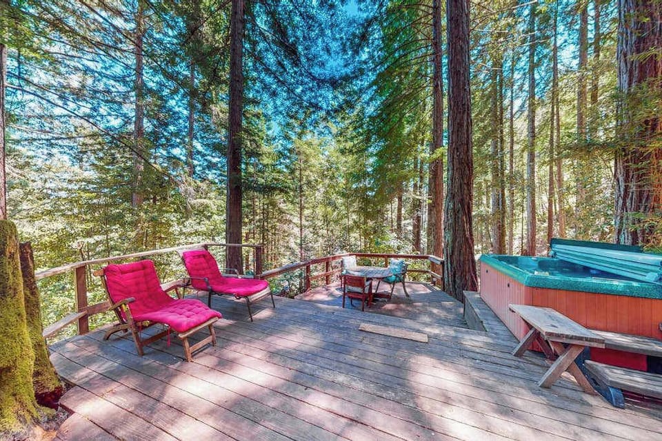 Settle into your private redwood-canopy deck where cushioned loungers and a bubbling hot tub create your own Cazadero forest spa beneath the treetops.