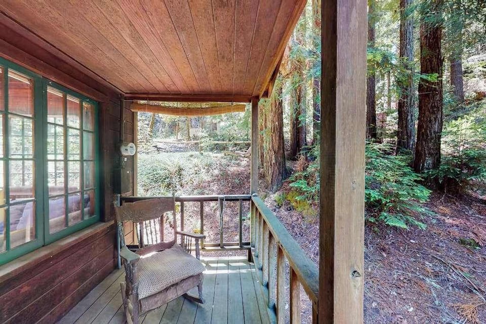 Sip your morning coffee on the covered front porch — surrounded by Cazadero redwoods and birdsong, this quiet perch is your gateway to forest tranquility.