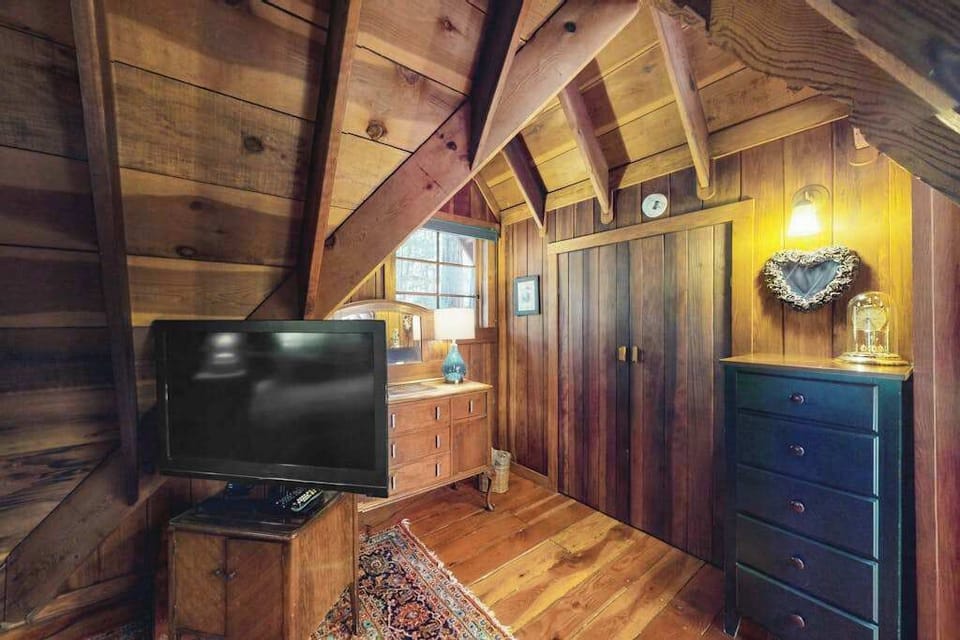 Your loft retreat comes complete with a flatscreen TV, wardrobe closet, and charming redwood details — everything you need for a cozy Cazadero evening in.
