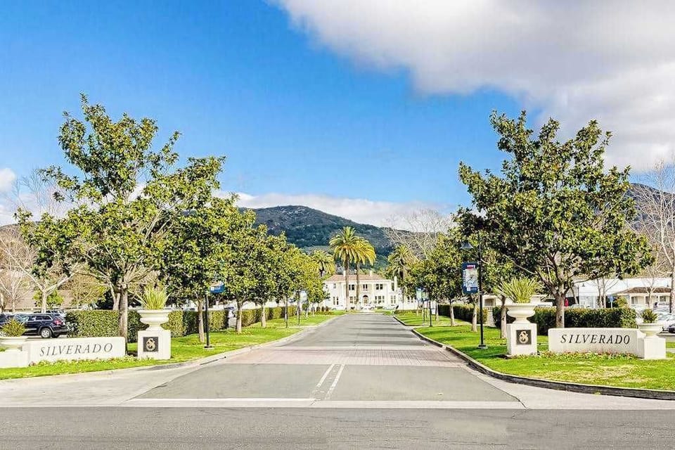 Arrive through Silverado's iconic tree-lined entrance with mountain views — your gateway to Napa Valley's finest wines, dining, and golf awaits.