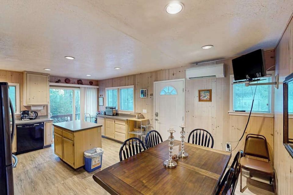 Spread out across the open kitchen-dining layout — your island prep station and gas range make cooking after the farmers market effortless.