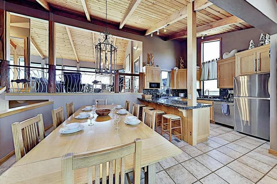 Prepare Sonoma Coast seafood in your open kitchen — stainless steel appliances, granite counters, and a chandelier-lit dining table set for six await your arrival.