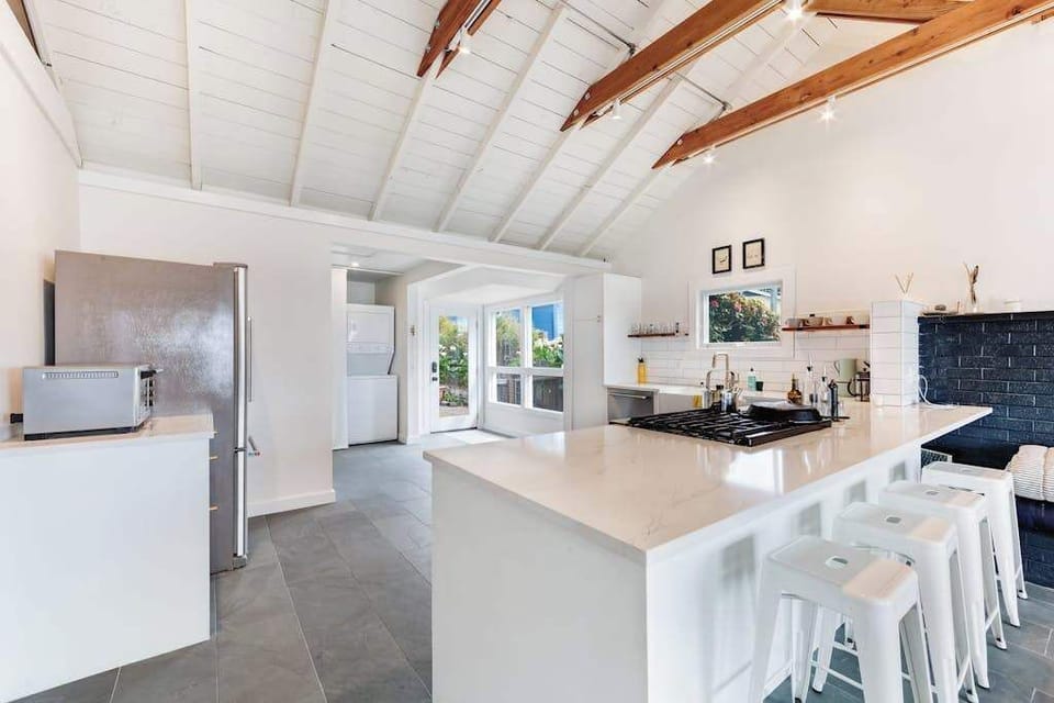 Cook your favorite Sonoma Coast recipes in this fully equipped kitchen with stainless appliances, island seating, and natural light.