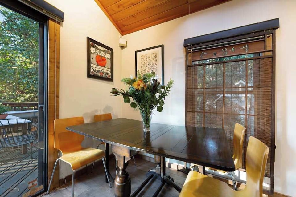 Linger over breakfast at the intimate dining nook with bamboo-shaded windows and deck access steps away.