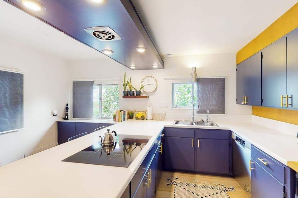 Ample workspace and natural light make your kitchen a joy to cook in — prep local Sonoma produce and pour a glass while gazing out at the redwood-lined landscape.