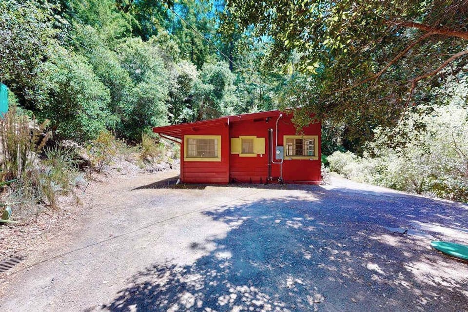 Nestled deep in the redwoods, your charming red cabin sits on a private gravel drive — total seclusion just minutes from downtown Guerneville tasting rooms.