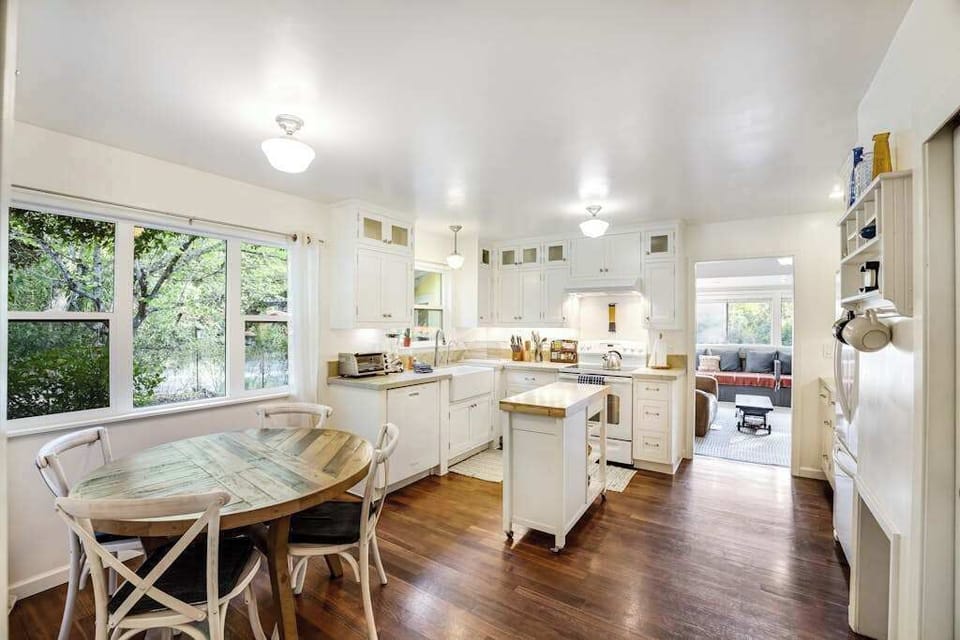 Gather around your cozy breakfast nook while morning light streams through garden-view windows in your well-appointed Cloverdale kitchen