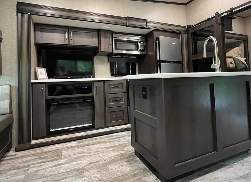 Electric fireplace and entertainment area for cool Smoky Mountain mornings