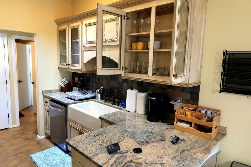 Farmhouse sink, dishwasher, and complimentary coffee and tea station