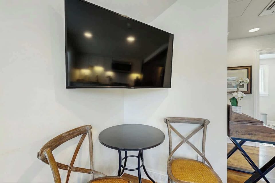 Corner Nook, enjoy your morning coffee in this charming space with a sleek TV for relaxing nights!