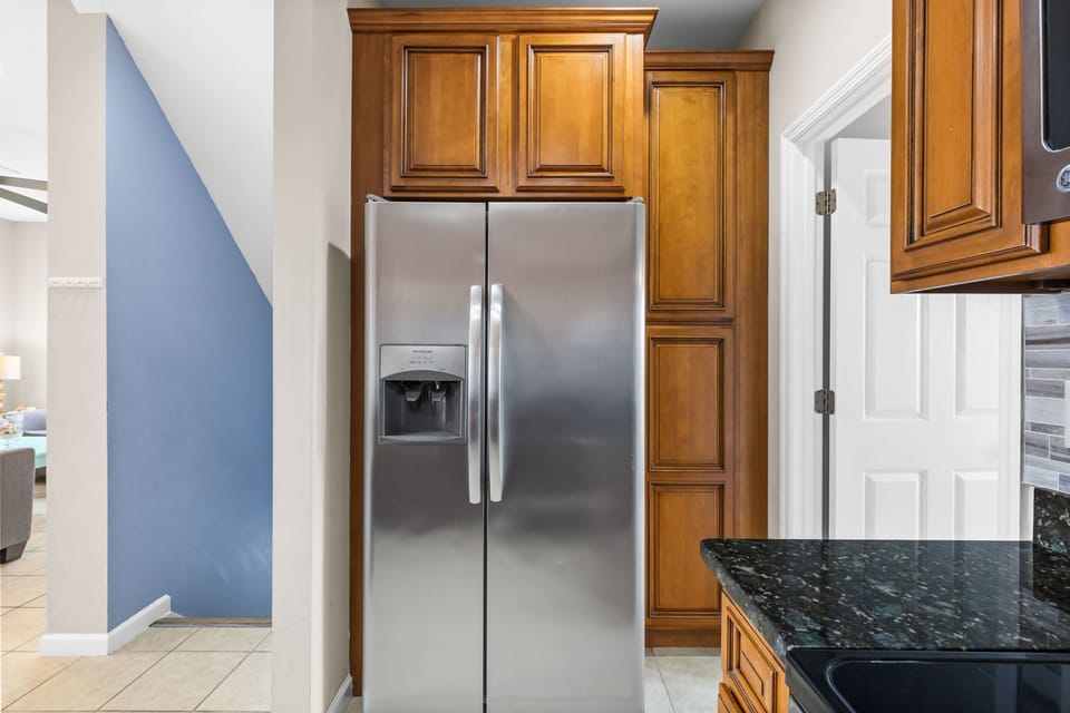 Spacious fridge and kitchen setup ready for everything from quick snacks to full meals
