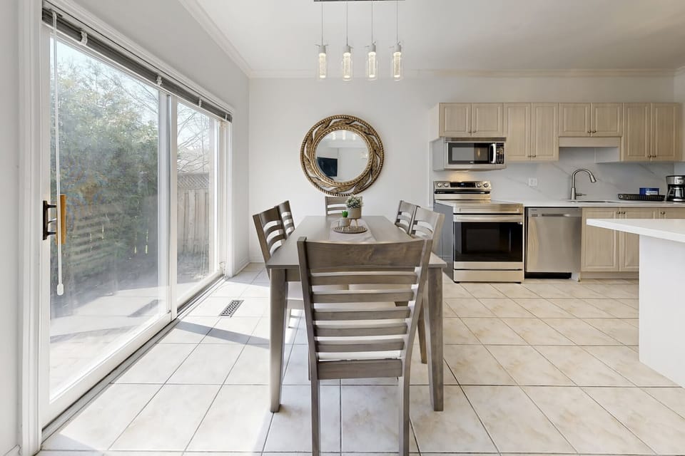 Sunny dining spot with direct access to the outdoor patio.