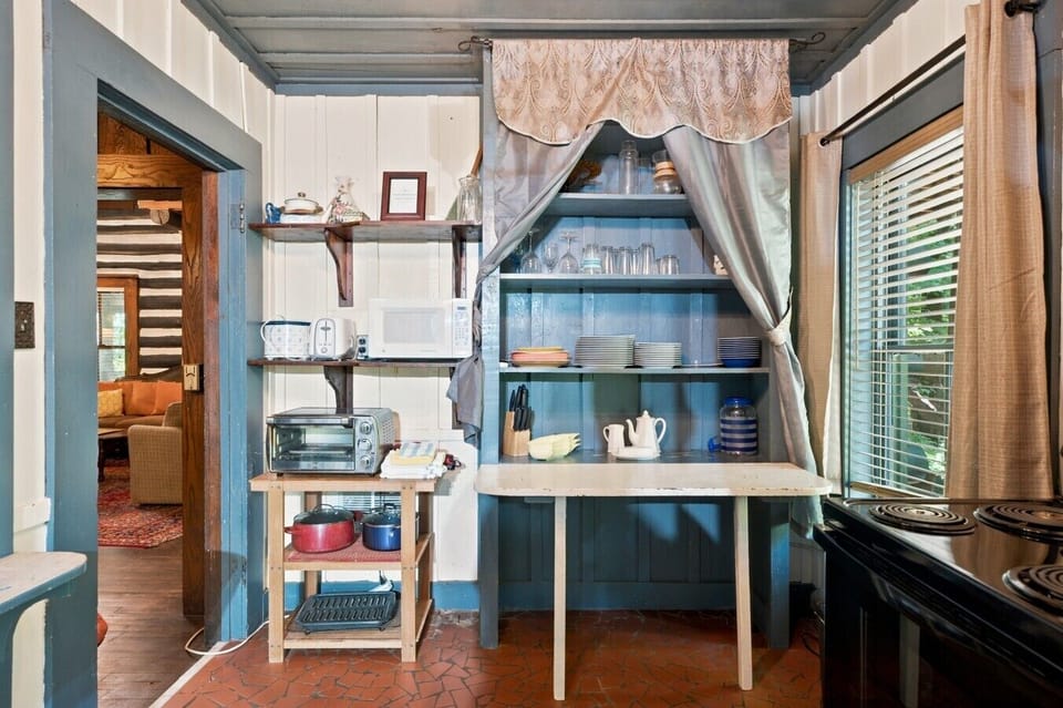 Main House Kitchen | Open Shelving & Toaster Oven | Stacked Cookware & Prep Table