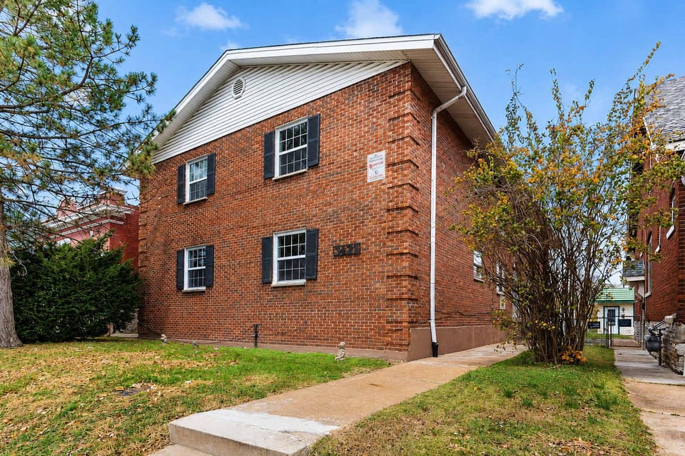 Brick exterior on Morganford Rd — free street parking + 4 reservable rear spots