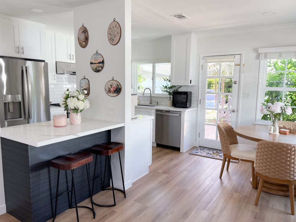 Dining table with 4 chairs and kitchen island with 2 bar stools