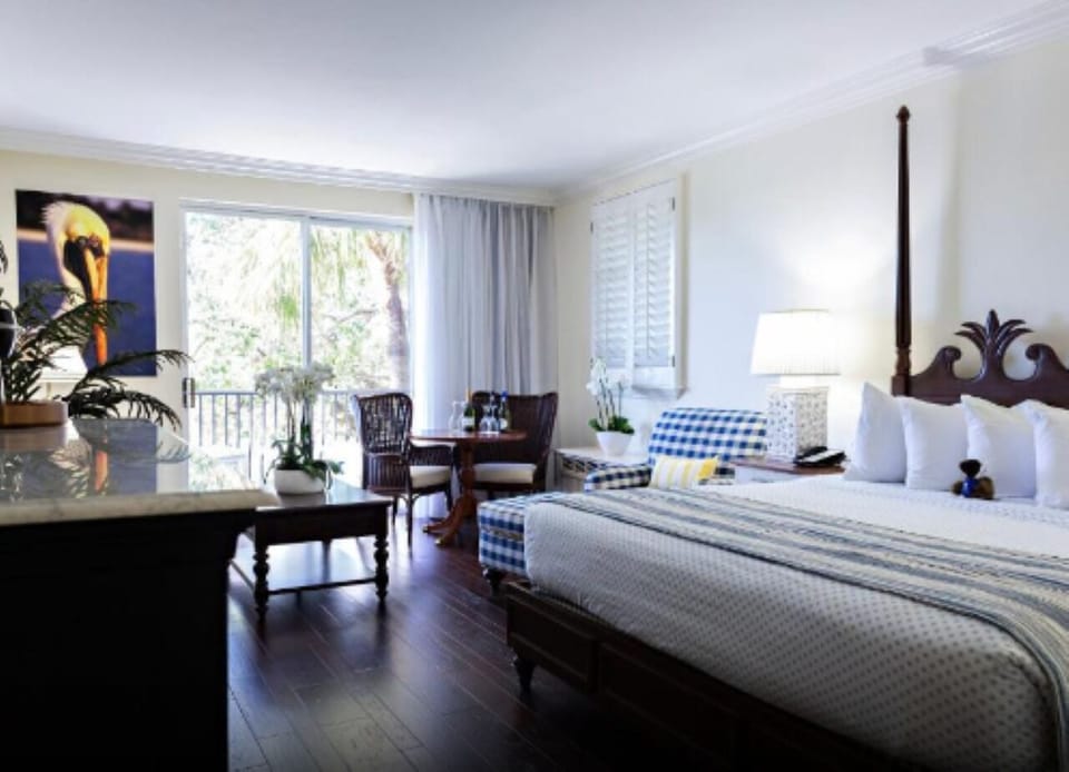 Wake up to sunlit comfort beside relaxing window-side seating.