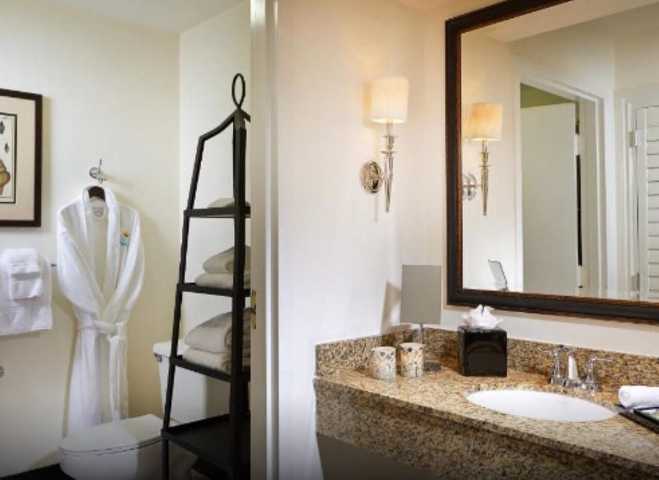 Refresh effortlessly with plush robes, bright vanity, and fresh towels.